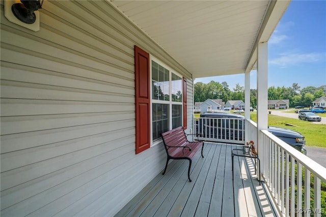 9949 Reymet Ct, North Chesterfield, VA 23237 - wooden porch with a residential view