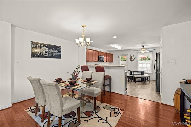 9949 Reymet Ct, North Chesterfield, VA 23237 - dining space with hardwood / wood-style flooring, a chandelier, and ceiling fan
