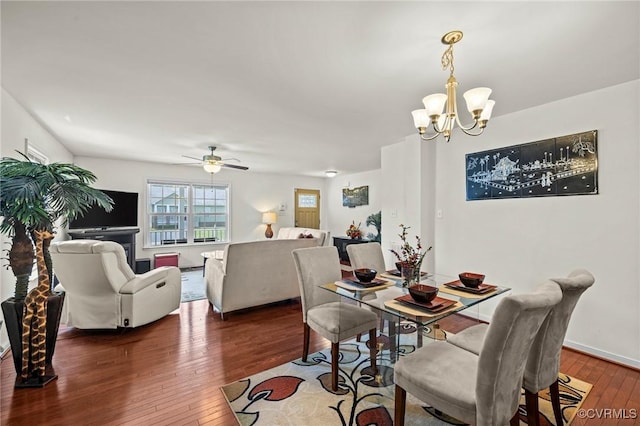 9949 Reymet Ct, North Chesterfield, VA 23237 - dining space featuring hardwood / wood-style flooring, a chandelier, and a ceiling fan