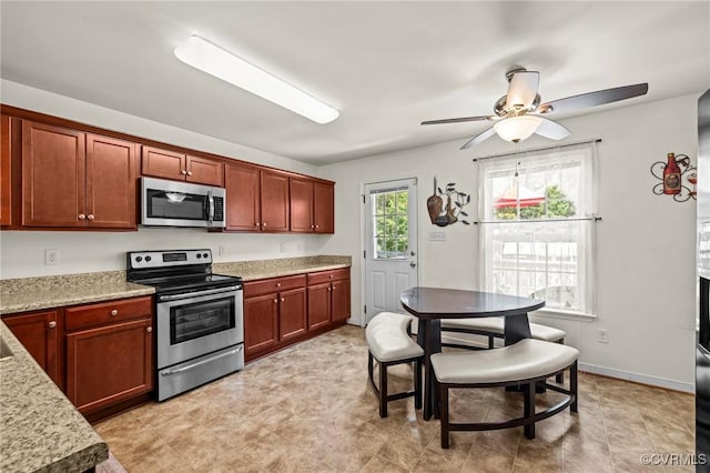 9949 Reymet Ct, North Chesterfield, VA 23237 - kitchen with stainless steel appliances, ceiling fan, and light stone countertops