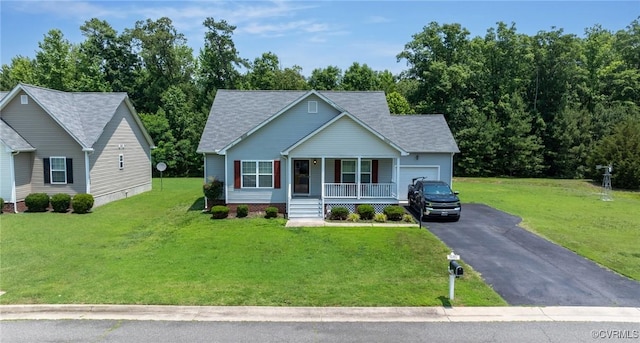 9949 Reymet Ct, North Chesterfield, VA 23237 - view of front facade featuring covered porch, driveway, an attached garage, and a front yard