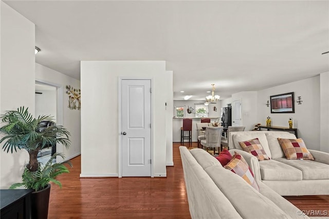 9949 Reymet Ct, North Chesterfield, VA 23237 - living room with a chandelier and dark wood-style floors