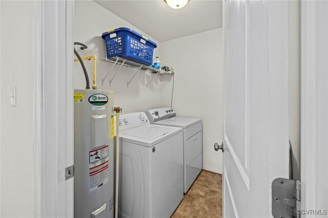 9949 Reymet Ct, North Chesterfield, VA 23237 - laundry area featuring electric water heater, washing machine and clothes dryer, and light tile patterned flooring
