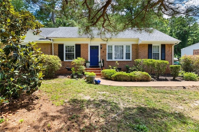 1708 Hollandale Rd, Henrico, VA 23238 - view of front of home featuring brick siding, roof with shingles, and a front lawn