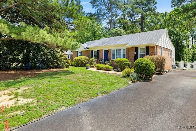 1708 Hollandale Rd, Henrico, VA 23238 - ranch-style home featuring brick siding, driveway, and roof with shingles