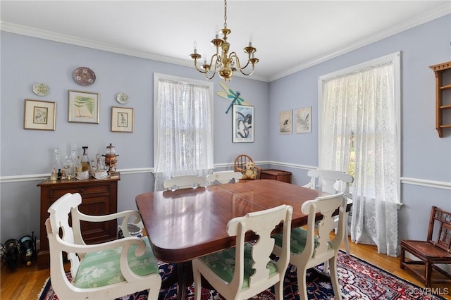 1708 Hollandale Rd, Henrico, VA 23238 - dining room featuring a chandelier, wood finished floors, and crown molding