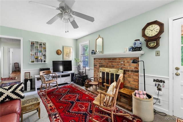 1708 Hollandale Rd, Henrico, VA 23238 - living room with a brick fireplace, ceiling fan, and a wainscoted wall