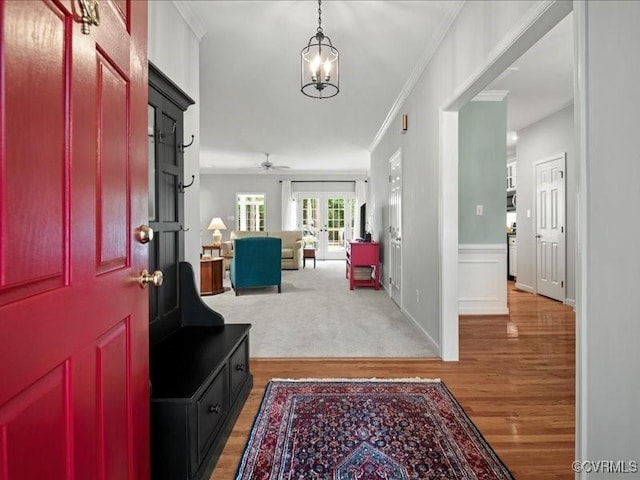 4416 Killiam Ct, Henrico, VA 23060 - foyer entrance featuring french doors, light wood-type flooring, crown molding, ceiling fan, and a chandelier