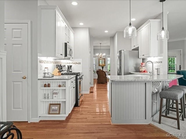 4416 Killiam Ct, Henrico, VA 23060 - kitchen with stainless steel appliances, backsplash, white cabinets, light wood-style floors, and recessed lighting