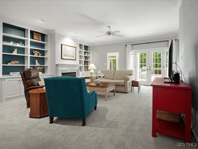 4416 Killiam Ct, Henrico, VA 23060 - living area with light carpet, french doors, a ceiling fan, a fireplace, and crown molding