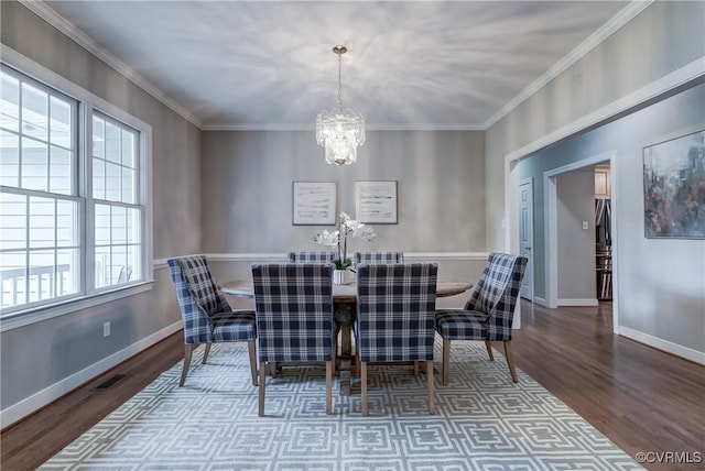 5501 Pine Needles Ter, Providence Forge, VA 23140 - dining space with plenty of natural light, wood finished floors, a chandelier, and crown molding