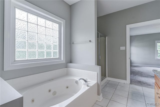 5501 Pine Needles Ter, Providence Forge, VA 23140 - bathroom featuring vanity, tile patterned floors, a whirlpool tub, and a stall shower