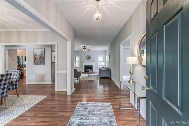 5501 Pine Needles Ter, Providence Forge, VA 23140 - foyer entrance with dark wood-type flooring, a fireplace, and ceiling fan