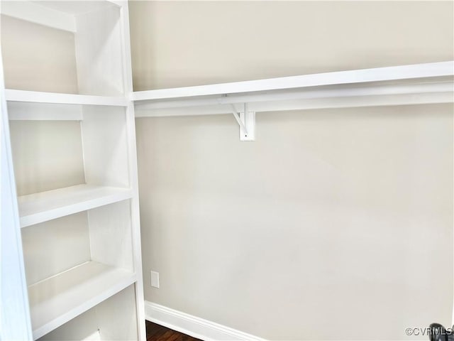 7335 Cherokee Rd, Richmond, VA 23225 - walk in closet featuring dark wood-style floors