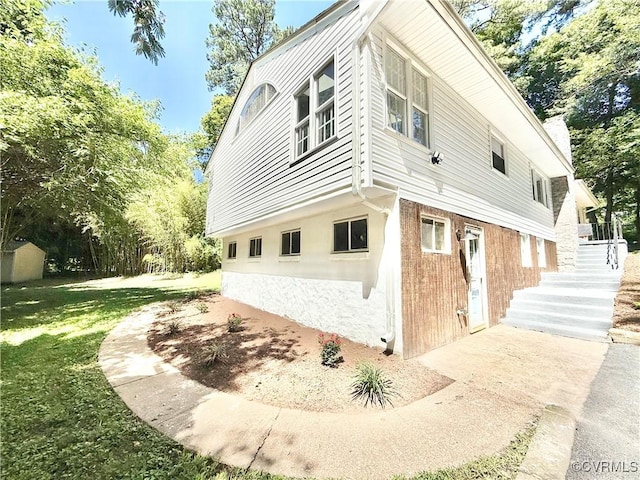 7335 Cherokee Rd, Richmond, VA 23225 - view of property exterior featuring a lawn