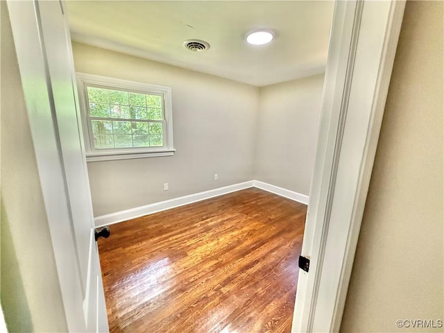 7335 Cherokee Rd, Richmond, VA 23225 - empty room with wood finished floors and baseboards