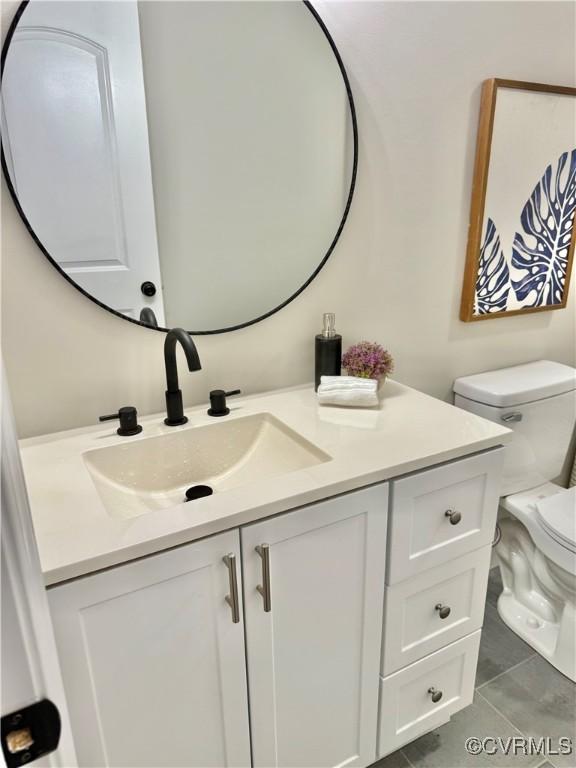 7335 Cherokee Rd, Richmond, VA 23225 - bathroom with vanity and tile patterned flooring