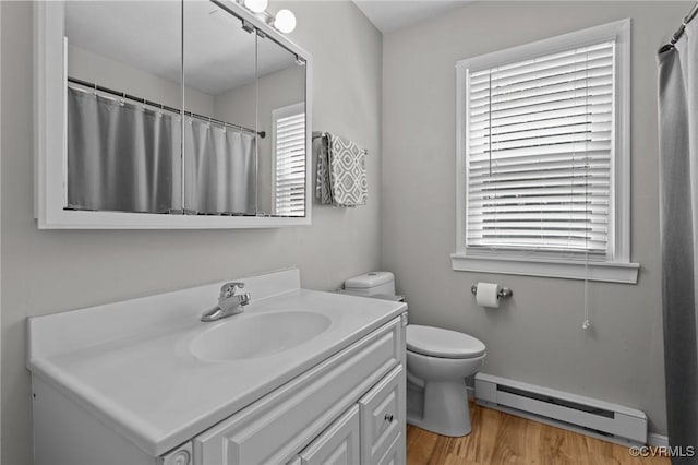 6521 N Midview Rd, Henrico, VA 23231 - full bathroom with baseboard heating, vanity, wood finished floors, and a shower with shower curtain