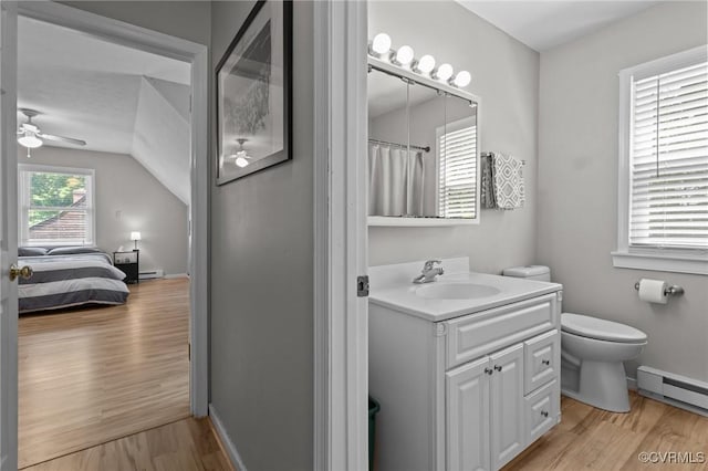 6521 N Midview Rd, Henrico, VA 23231 - bathroom with a ceiling fan, wood finished floors, vanity, ensuite bath, and baseboard heating