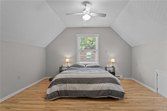 6521 N Midview Rd, Henrico, VA 23231 - bedroom with light wood-type flooring, lofted ceiling, a baseboard heating unit, and ceiling fan