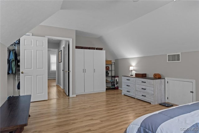 6521 N Midview Rd, Henrico, VA 23231 - bedroom with light wood-type flooring, vaulted ceiling, and a baseboard heating unit