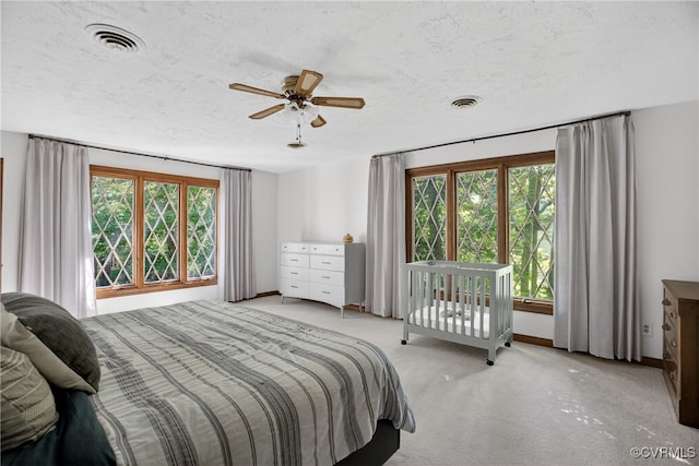 8327 Fulham Ct, Richmond, VA 23227 - carpeted bedroom with multiple windows and a textured ceiling