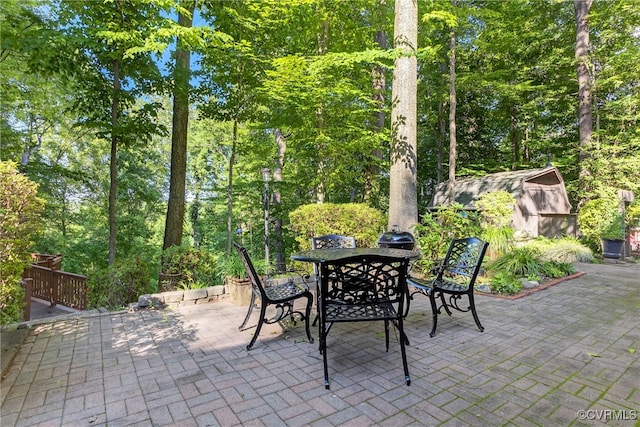 8327 Fulham Ct, Richmond, VA 23227 - view of patio featuring outdoor dining space and a storage shed