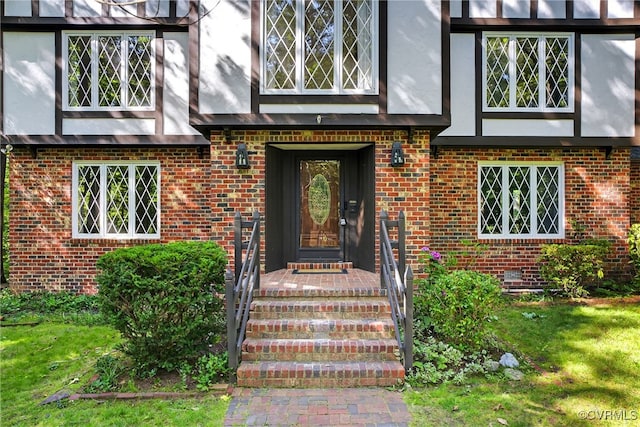 8327 Fulham Ct, Richmond, VA 23227 - entrance to property with brick siding, stucco siding, and a lawn