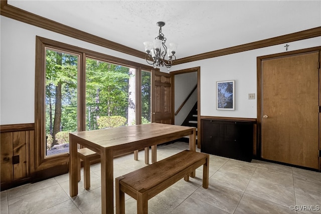 8327 Fulham Ct, Richmond, VA 23227 - dining space with a chandelier, ornamental molding, stairway, a wainscoted wall, and light tile patterned floors