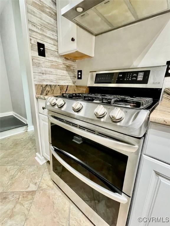 11767 N Briar Patch Dr, Midlothian, VA 23113 - kitchen with range with two ovens, white cabinetry, and light stone counters