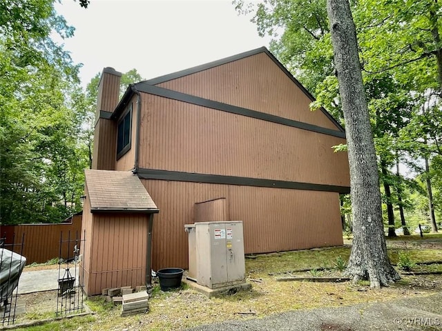 11767 N Briar Patch Dr, Midlothian, VA 23113 - view of side of property featuring a chimney and an outbuilding