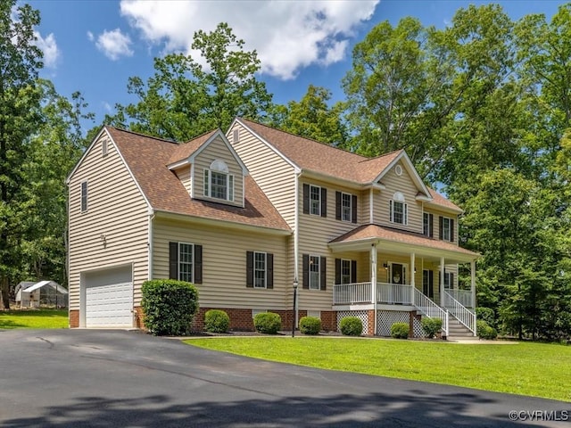 1960 Teal Ln, Powhatan, VA 23139 - view of front facade featuring covered porch, a shingled roof, a front lawn, and asphalt driveway