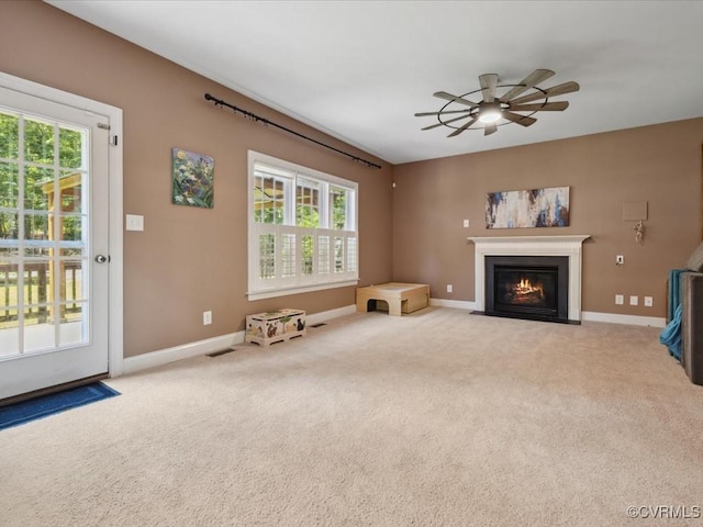 1960 Teal Ln, Powhatan, VA 23139 - unfurnished living room with a ceiling fan, healthy amount of natural light, a fireplace with flush hearth, and carpet floors