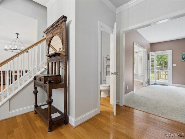 1960 Teal Ln, Powhatan, VA 23139 - stairway with a chandelier, wood finished floors, and ornamental molding