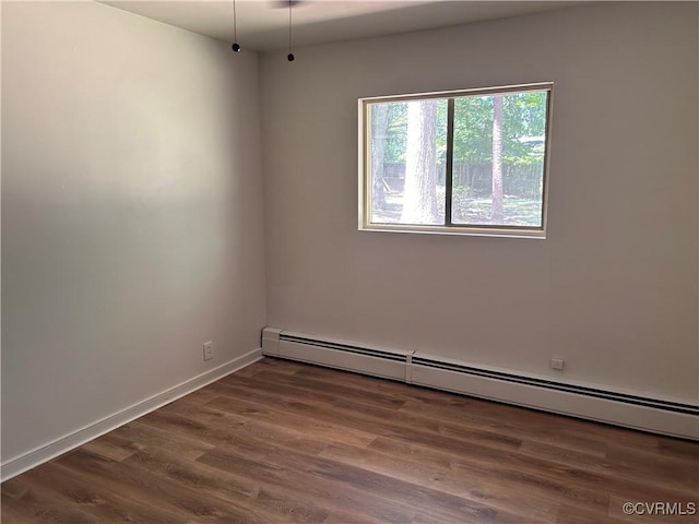 11532 Elmwood Ln, Chester, VA 23831 - unfurnished room featuring a baseboard radiator and wood finished floors