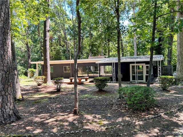 11532 Elmwood Ln, Chester, VA 23831 - rear view of property with a chimney and a carport