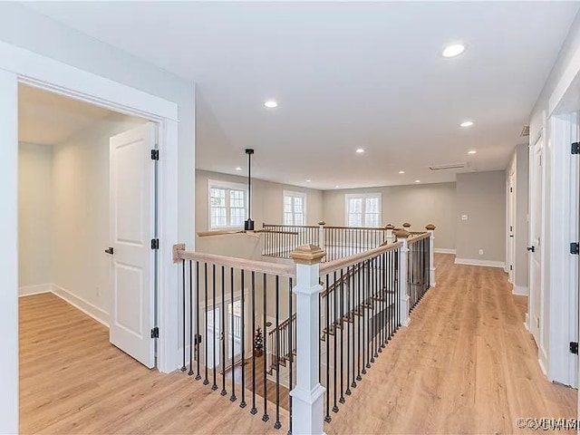 4788 Powhatan Lakes Rd, Powhatan, VA 23139 - corridor featuring an upstairs landing, light wood-style floors, recessed lighting, and plenty of natural light