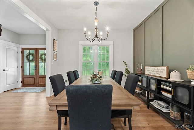 4788 Powhatan Lakes Rd, Powhatan, VA 23139 - dining area featuring a chandelier, light wood-type flooring, and french doors