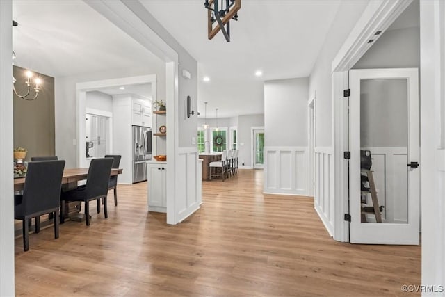 4788 Powhatan Lakes Rd, Powhatan, VA 23139 - dining room featuring light wood finished floors, recessed lighting, a decorative wall, a chandelier, and a wainscoted wall