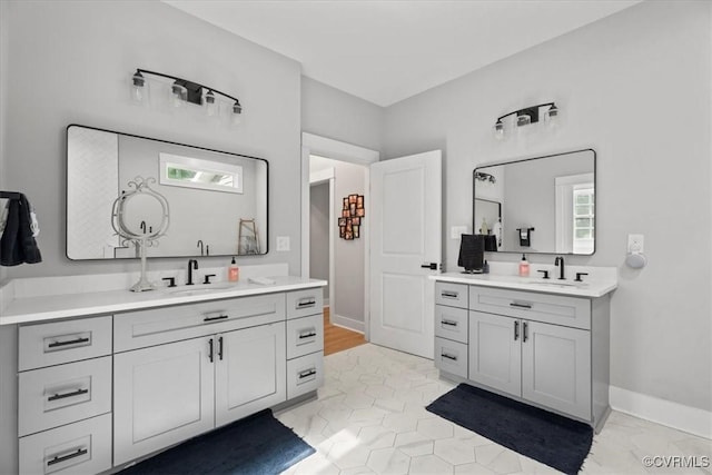 4788 Powhatan Lakes Rd, Powhatan, VA 23139 - bathroom with two vanities and baseboards