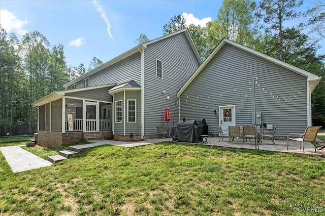4788 Powhatan Lakes Rd, Powhatan, VA 23139 - rear view of house with a patio, a sunroom, and a yard