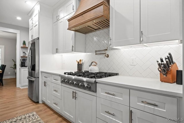 4788 Powhatan Lakes Rd, Powhatan, VA 23139 - kitchen with premium range hood, stainless steel appliances, white cabinetry, light countertops, and recessed lighting