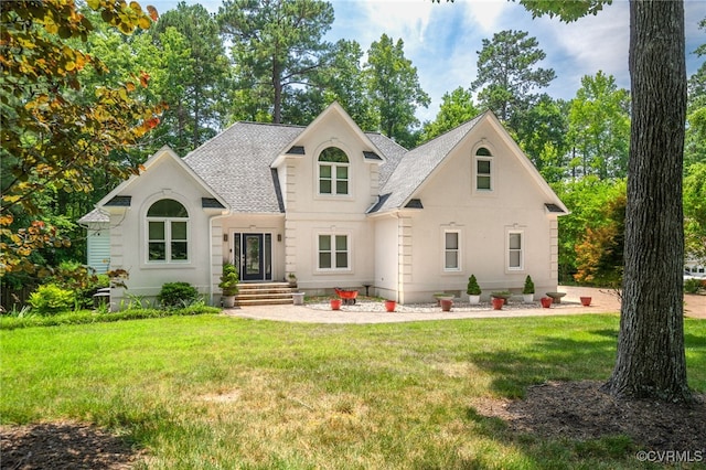 14221 Sylvan Ridge Rd, Chesterfield, VA 23838 - view of front of house with roof with shingles, a front lawn, and stucco siding