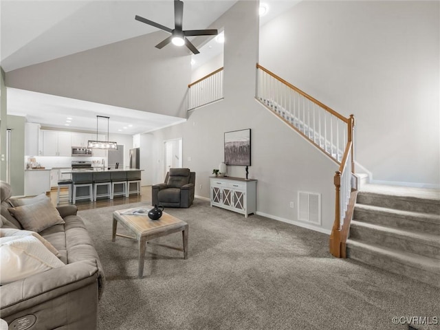 12306 Hollow Oak Ter, Midlothian, VA 23112 - carpeted living area featuring stairway, ceiling fan, high vaulted ceiling, and a chandelier