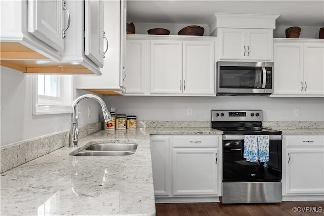 4473 Pin Oak Rd, Prospect, VA 23960 - kitchen featuring stainless steel appliances, white cabinetry, light stone counters, and dark wood-type flooring