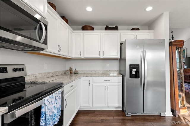 4473 Pin Oak Rd, Prospect, VA 23960 - kitchen with appliances with stainless steel finishes, dark wood-style floors, white cabinetry, light stone counters, and recessed lighting