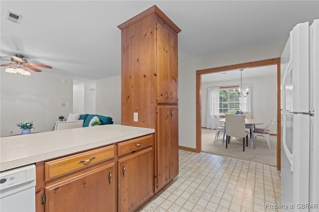 11192 Eventide Ln, Gloucester, VA 23061 - kitchen with white appliances, light countertops, a ceiling fan, and brown cabinets