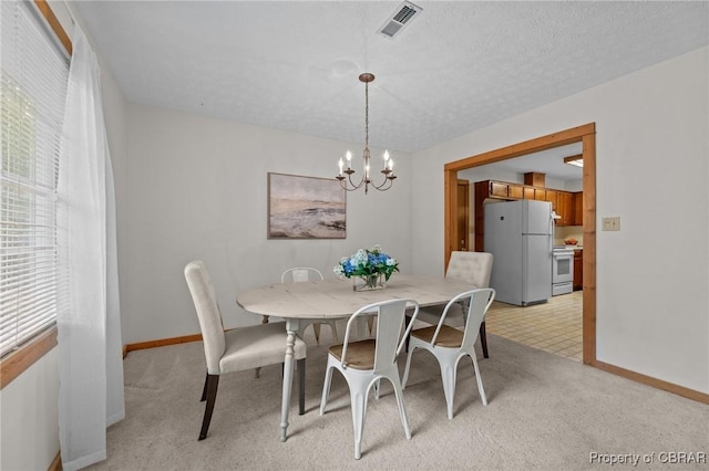 11192 Eventide Ln, Gloucester, VA 23061 - dining area featuring a chandelier and light colored carpet