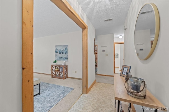 11192 Eventide Ln, Gloucester, VA 23061 - corridor featuring a textured ceiling and baseboards
