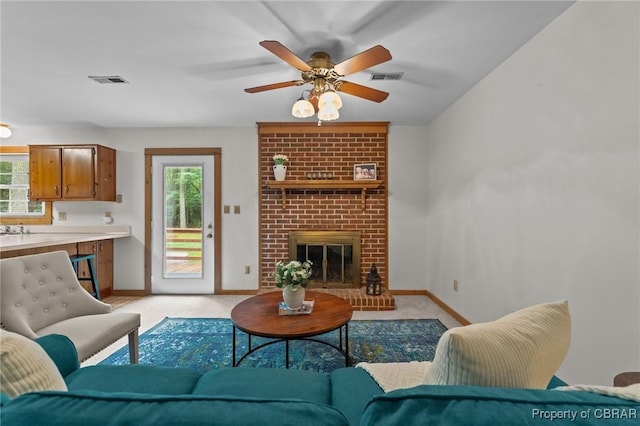 11192 Eventide Ln, Gloucester, VA 23061 - living room featuring a ceiling fan, light carpet, and a fireplace